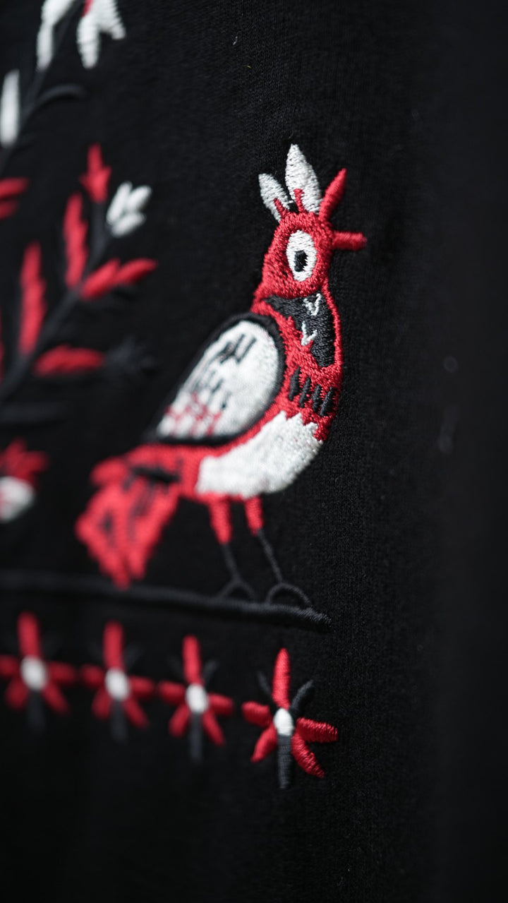 Ahimsa 01 — songbird embroidery detail